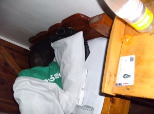 Clarice in the health centre with her insurance card beside her.